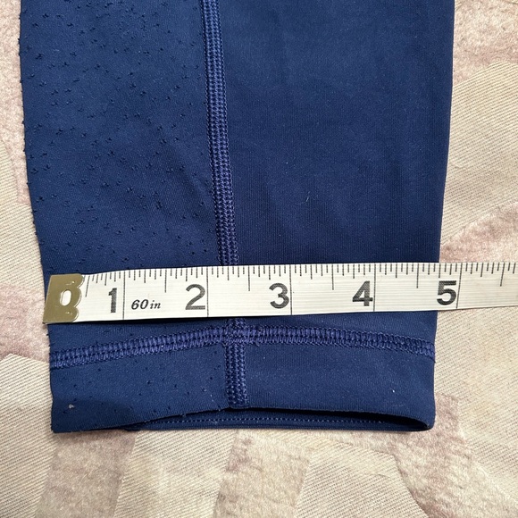 Lululemon navy leggings w/ laser cut design down sides - Picture 8 of 10